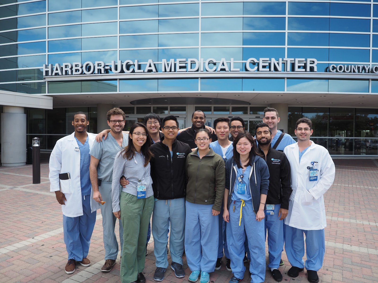 A modern hospital building exterior on a sunny day